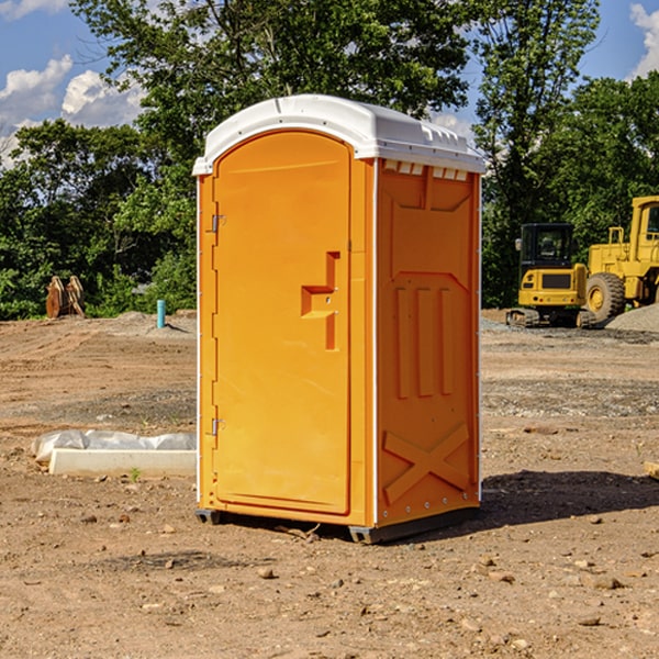 what is the cost difference between standard and deluxe portable restroom rentals in Schoolcraft